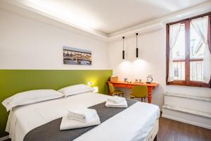 Ένα ή περισσότερα κρεβάτια σε δωμάτιο στο Pisana 236 Suites +7 φωτογραφίες