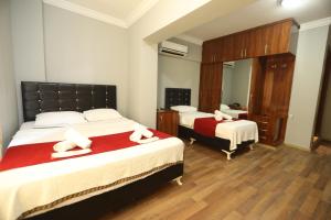 Postel nebo postele na pokoji v ubytování BALŞEN HOTEL