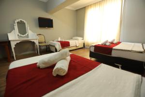 Postel nebo postele na pokoji v ubytování BALŞEN HOTEL