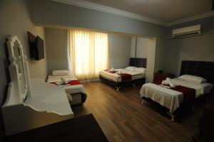 Postel nebo postele na pokoji v ubytování BALŞEN HOTEL