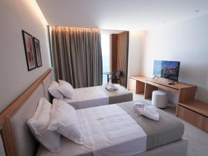 Letto o letti in una camera di Sunrise Qeparo