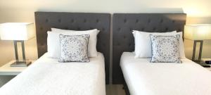 Katil atau katil-katil dalam bilik di Darwin Harbour Suite