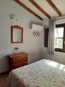 A bed or beds in a room at Apartamentos El Calambuco