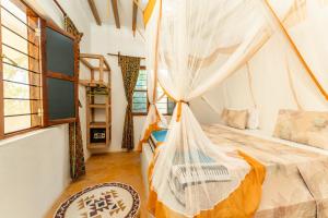 Postel nebo postele na pokoji v ubytování Matemwe Ocean View Villas + 35 fotografií