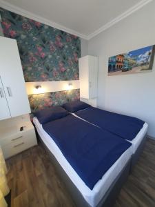 Posteľ alebo postele v izbe v ubytovaní Lara Apartments