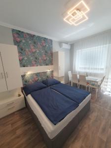 Posteľ alebo postele v izbe v ubytovaní Lara Apartments