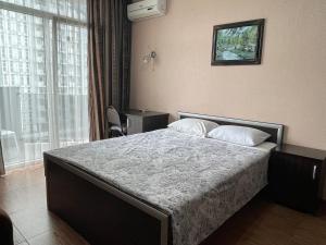 Ένα ή περισσότερα κρεβάτια σε δωμάτιο στο Orbi Towers by the Sea