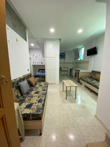 Μια τηλεόραση ή/και κέντρο ψυχαγωγίας στο Appartement S1 pieds dans l'eau