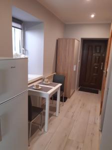 Kuchyň nebo kuchyňský kout v ubytování Apartament Kamienica + 3 fotografie