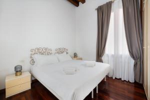 Cama o camas de una habitación en San Marco Canal View by Bricola Apartments