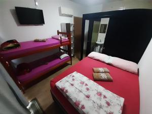 En eller flere senge i et værelse på Hotel da JAKE