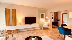 Μια τηλεόραση ή/και κέντρο ψυχαγωγίας στο Moderne Wohnung - 89m2 - 3 min zum Bahnhof & City