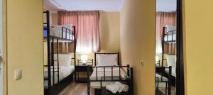 Postel nebo postele na pokoji v ubytování Light Hotel
