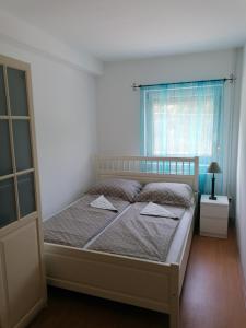 Posteľ alebo postele v izbe v ubytovaní Katica Apartman