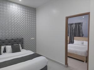 Postel nebo postele na pokoji v ubytování Sapphire Stayss