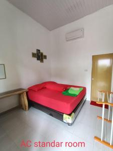 Ein Bett oder Betten in einem Zimmer der Unterkunft AAL Homestay