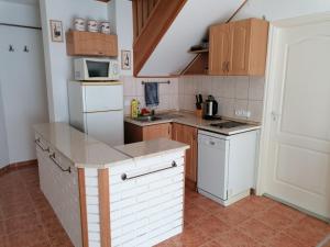 Kuchyňa alebo kuchynka v ubytovaní Katica Apartman