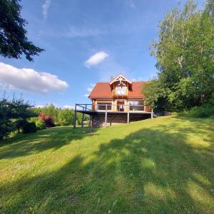 a large house with a large grassy yard at DUSZNICa 35 in Sejny