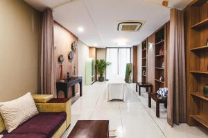 a living room with a couch and a table at Brahma Horizon Hotel & Spa - Pushkar in Pushkar