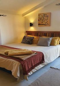 a bedroom with a large bed in a room at Perdehoek Venue in Lichtenburg