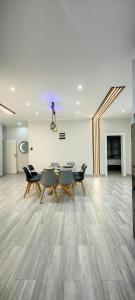 a room with a table and chairs and a fireplace at Caribbean Estates Villa Varie - Luxury accommodation in Port Edward