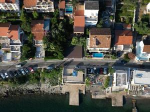 an overhead view of a house next to the water at Apartments Montevibe in Tivat