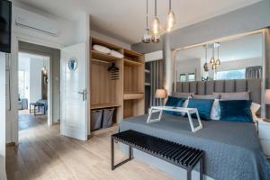 a bedroom with a large bed with blue pillows at Boat Villa in Yenion +31 photos