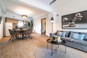 a living room with a couch and a table at Boat Villa in Yenion