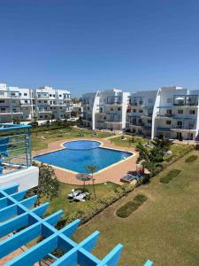 an aerial view of a large apartment complex with a swimming pool at Capo-martil Riviera residence three piscine in Cabo Negro
