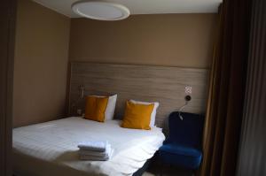 Letto o letti in una camera di Hotel Mille Colonnes