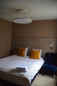 Letto o letti in una camera di Hotel Mille Colonnes