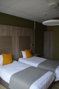 Letto o letti in una camera di Hotel Mille Colonnes