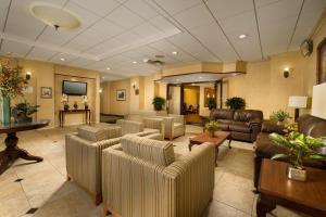 a large living room with couches and a tv at Quality Inn in Baltimore