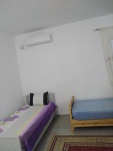 Postel nebo postele na pokoji v ubytování Tezdaine villa