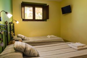 Postel nebo postele na pokoji v ubytování Hotel Rural Somiedo