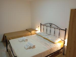 Postel nebo postele na pokoji v ubytování Borgo Family Suite