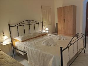 Postel nebo postele na pokoji v ubytování Borgo Family Suite
