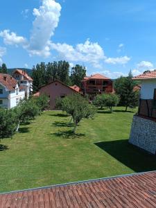 a view of a yard with trees and houses at Etno Kuća - Rakić in Svrljig