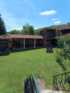 a house with a large yard in front of it at Etno Kuća - Rakić in Svrljig