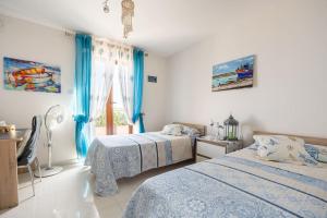 Postelja oz. postelje v sobi nastanitve Seagull Penthouse Marsaxlokk
