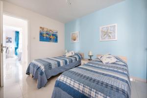 Postelja oz. postelje v sobi nastanitve Seagull Penthouse Marsaxlokk