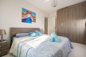 Postelja oz. postelje v sobi nastanitve Seagull Penthouse Marsaxlokk