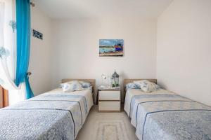 Postelja oz. postelje v sobi nastanitve Seagull Penthouse Marsaxlokk