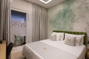 Postel nebo postele na pokoji v ubytování Nayel Hotel + 37 fotografií
