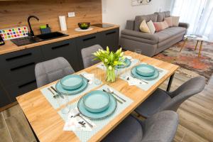 a dining room table with blue dishes on it at Complex nine in Osijek