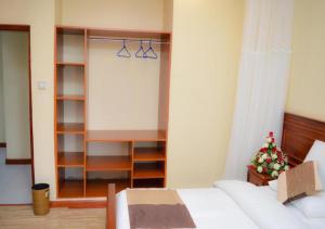 Kama o mga kama sa kuwarto sa Red Ruby Hotel