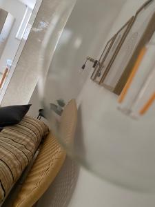 a living room with a couch and a chair at Villa Serena in Monopoli +32 photos