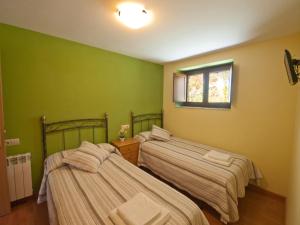 Postel nebo postele na pokoji v ubytování Hotel Rural Somiedo