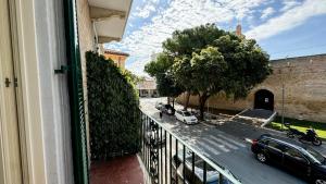 a balcony with a view of a street with cars at Alta Marea Casa Vacanze in Porto Recanati
