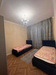 En eller flere senge i et værelse på Novel Townhouse